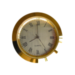 Pendule à quartz à encastrer diamètre 37mm en métal doré.